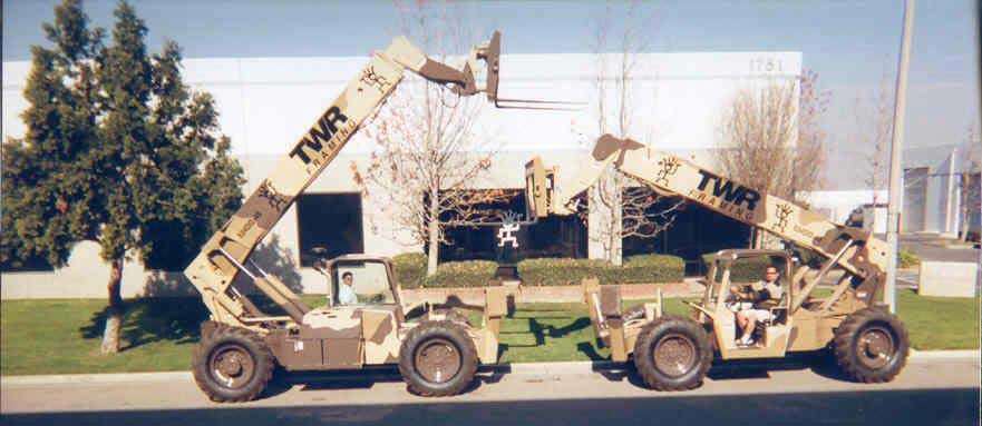 Photo of the second TWR building and two heavy duty vehicles.